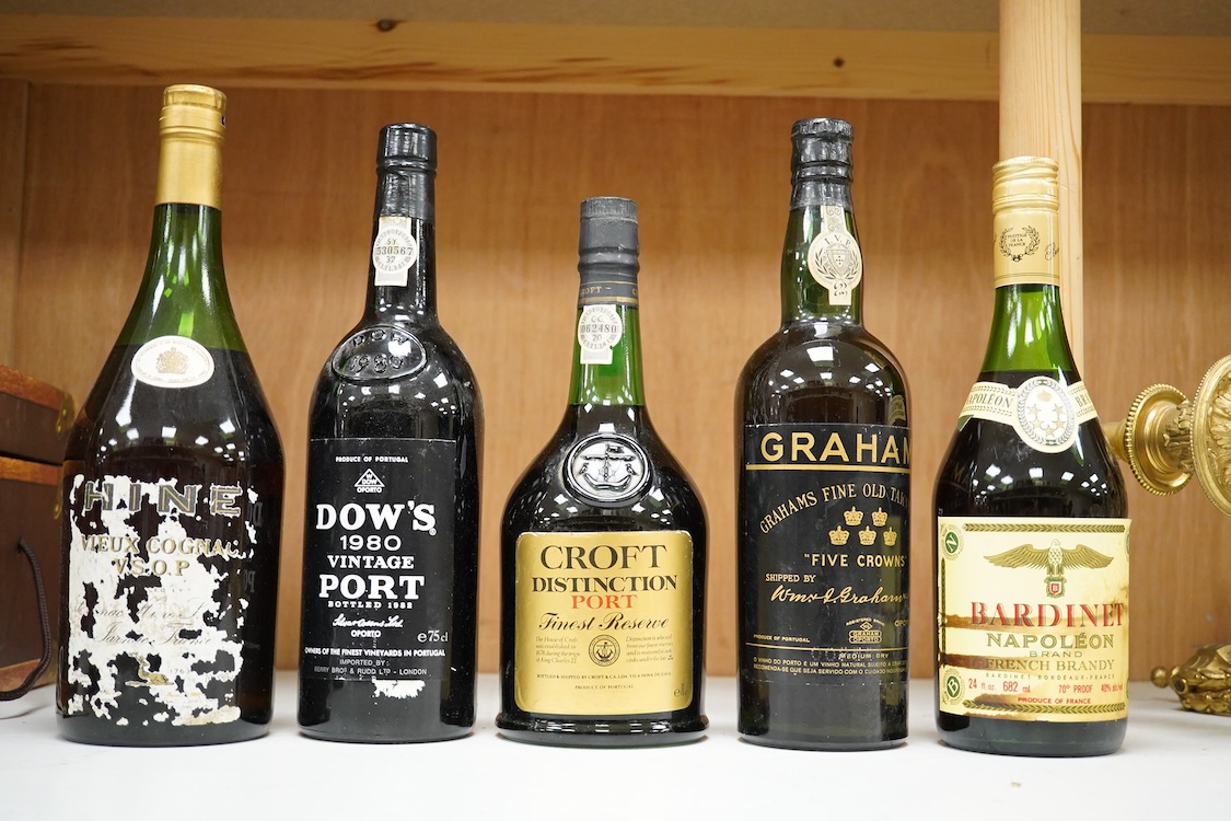 Five bottles of port and brandy, including a bottle of Dow’s 1980 bottle of port